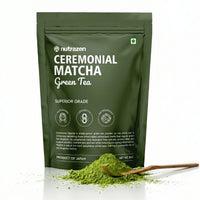 A dark green stand-up pouch of nutrazen Ceremonial Matcha Green Tea, shown with a small pile of bright green matcha powder and a wooden spoon in the foreground on a white background.