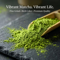 Bright green matcha powder spilled on a dark slate surface with a wooden scoop holding more powder. White text at the top reads, 'Vibrant Matcha.